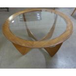 A G-Plan Astro teak and glass topped circular coffee table