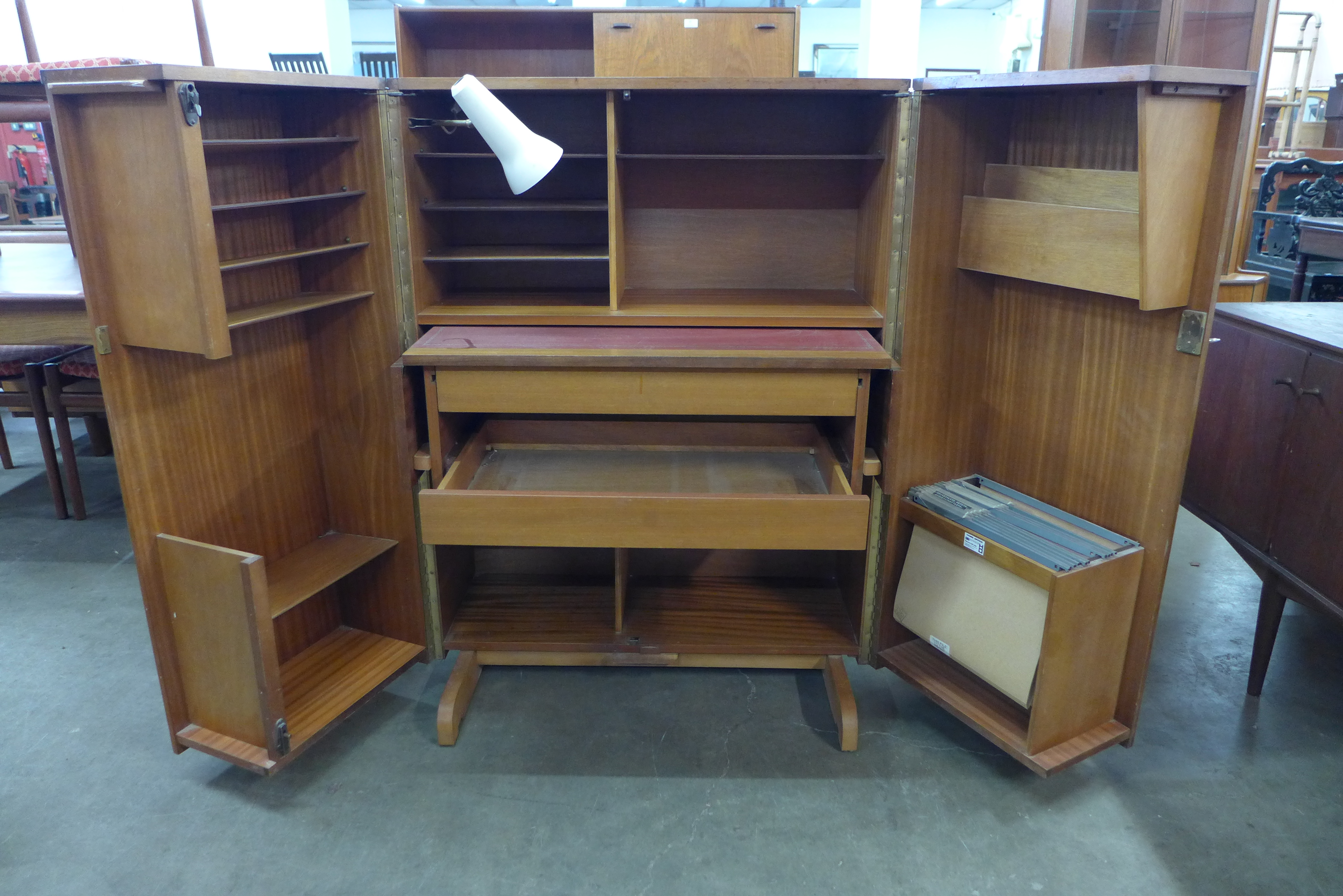 A Newcraft Ltd. teak home office cabinet