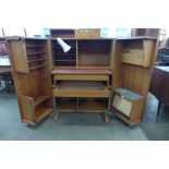 A Newcraft Ltd. teak home office cabinet