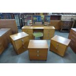 A Stag teak dressing table and stool and three matching bedside chests