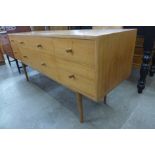 A teak six drawer sideboard