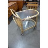 An Angraves bamboo and glass topped trolley