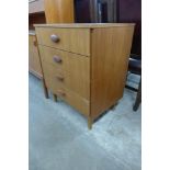 A teak chest of drawers