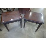 A pair of Stag Minstrel mahogany lamp tables