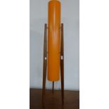 A teak floor standing rocket lamp