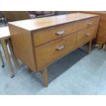 A teak four drawer sideboard