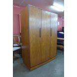 A G-Plan Fresco teak three door wardrobe