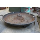 A small cast iron Mexican hat pig feeding trough