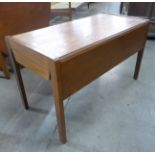 A teak rectangular drop leaf coffee table