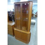 A Turnidge of London teak freestanding corner cabinet