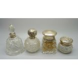 Four silver topped glass scent bottles/dressing table pots, including a scent bottle in the shape of