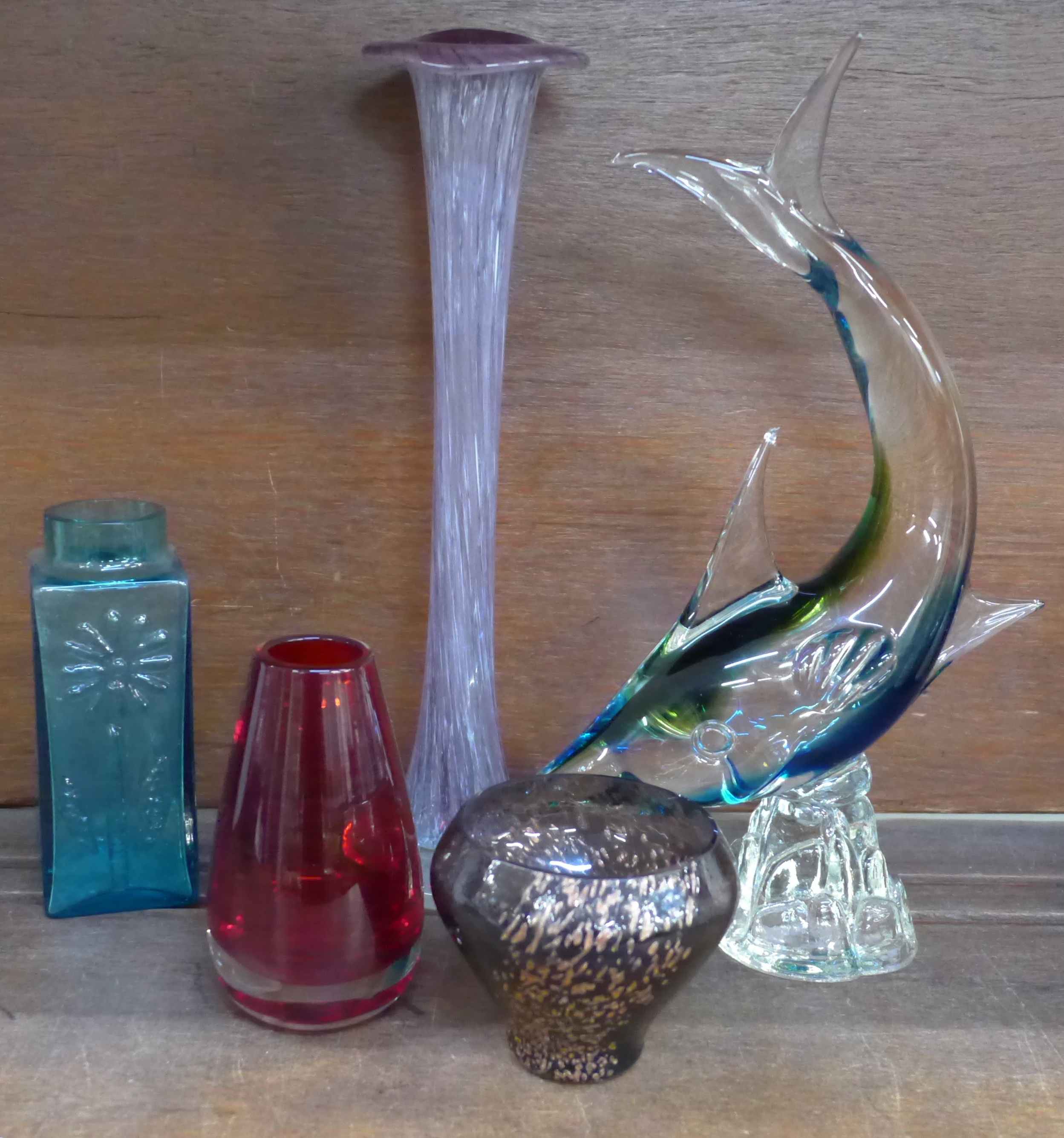 Five pieces of art glass, a Murano style fish, Whitefriars tapered ruby cased vase (9464),