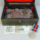 A collection of coins including three £5 coins, four Guernsey and Alderney £5 coins, Churchill