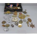 A collection of military badges and a Pacific Star medal