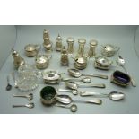 A collection of silver condiments, silver condiment spoons and other silver spoons, approximately