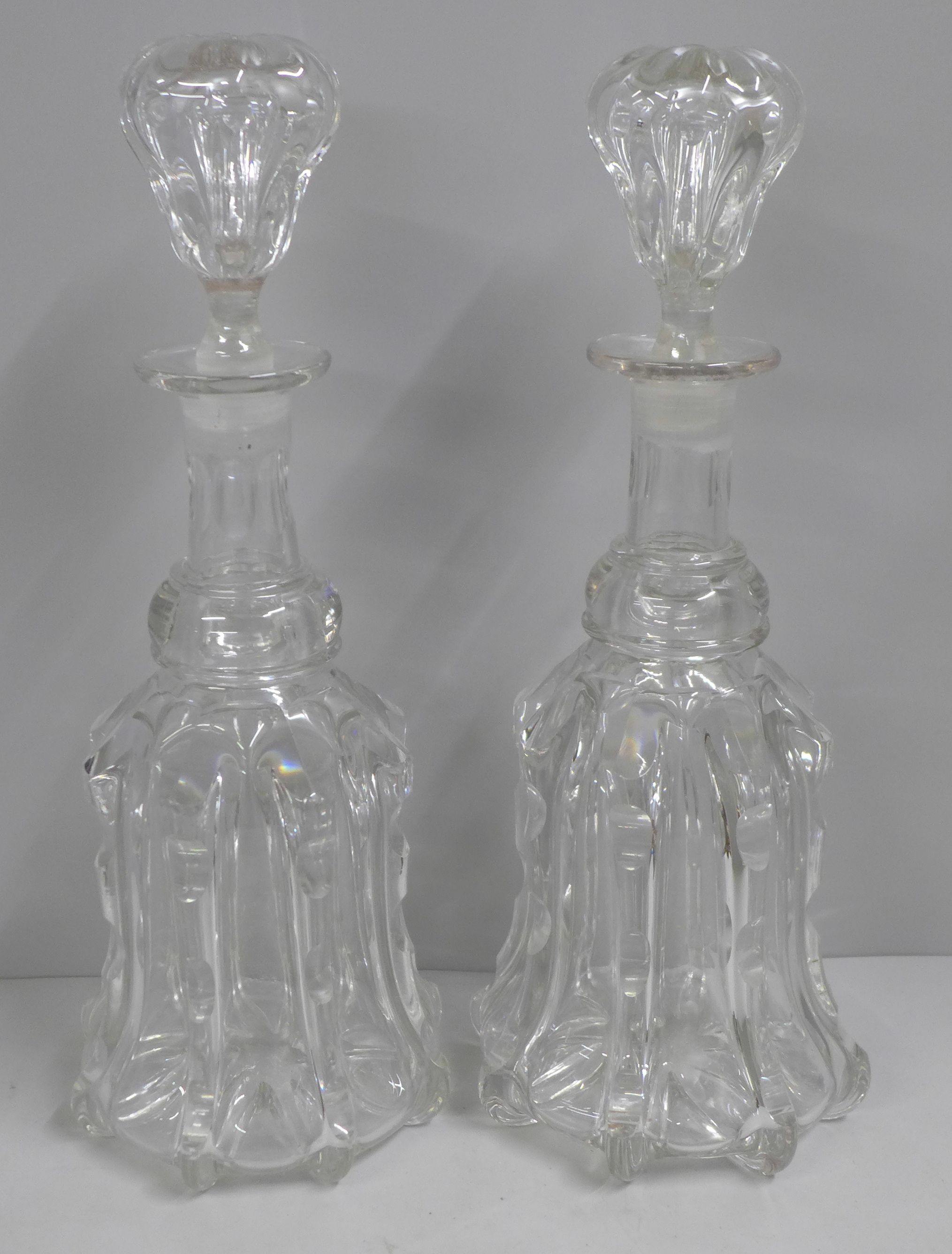 A pair of Victorian Newcastle bell shaped crystal decanters