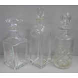 Three decanters; Baccarat, Orrefors and one other