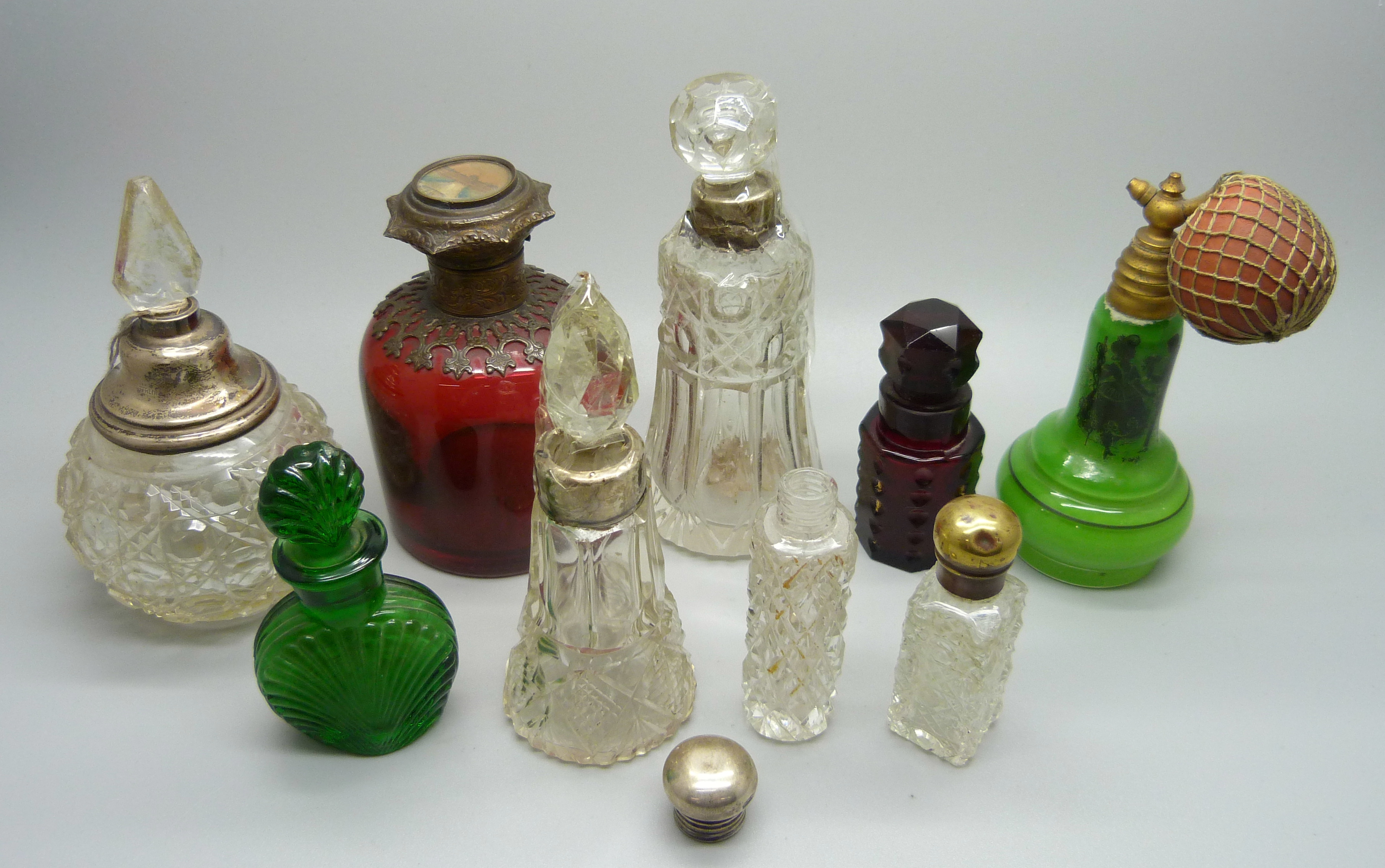 a collection of scent bottles, some a/f