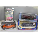 Four model cars including Corgi 1940's DC Comics Batmobile, Signature Models, Sun Star and Haynes