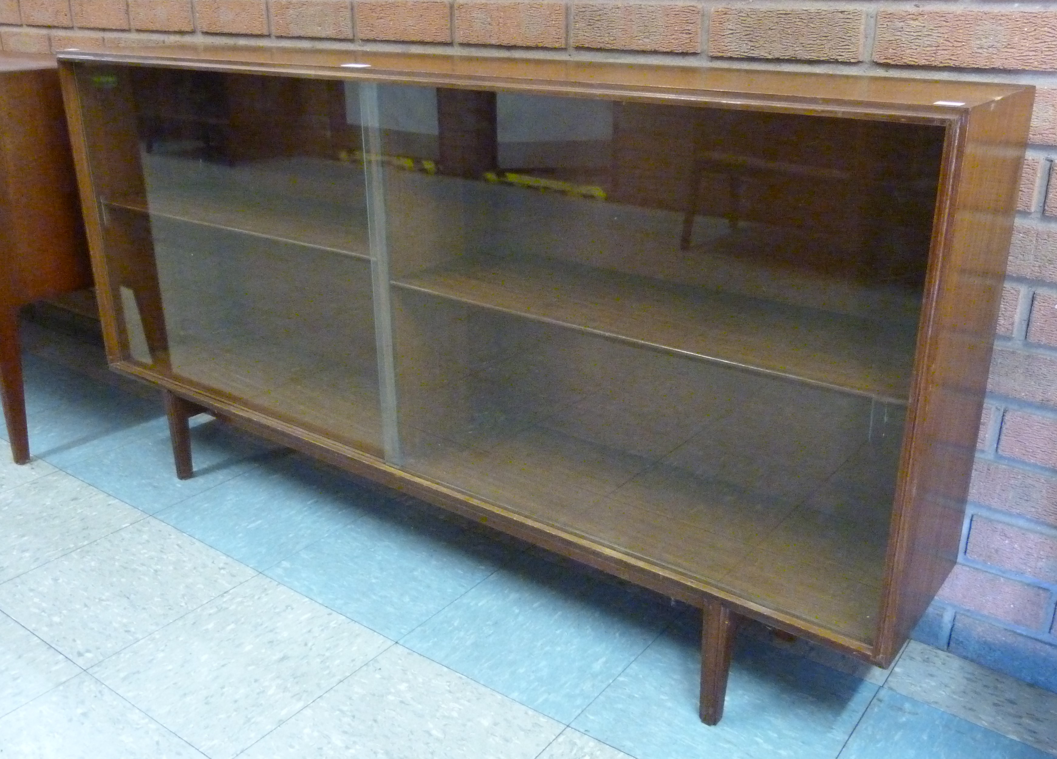 A Beaver & Tapley tola wood bookcase