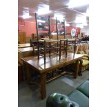 A French elm farmhouse single drawer table and four ladderback chairs