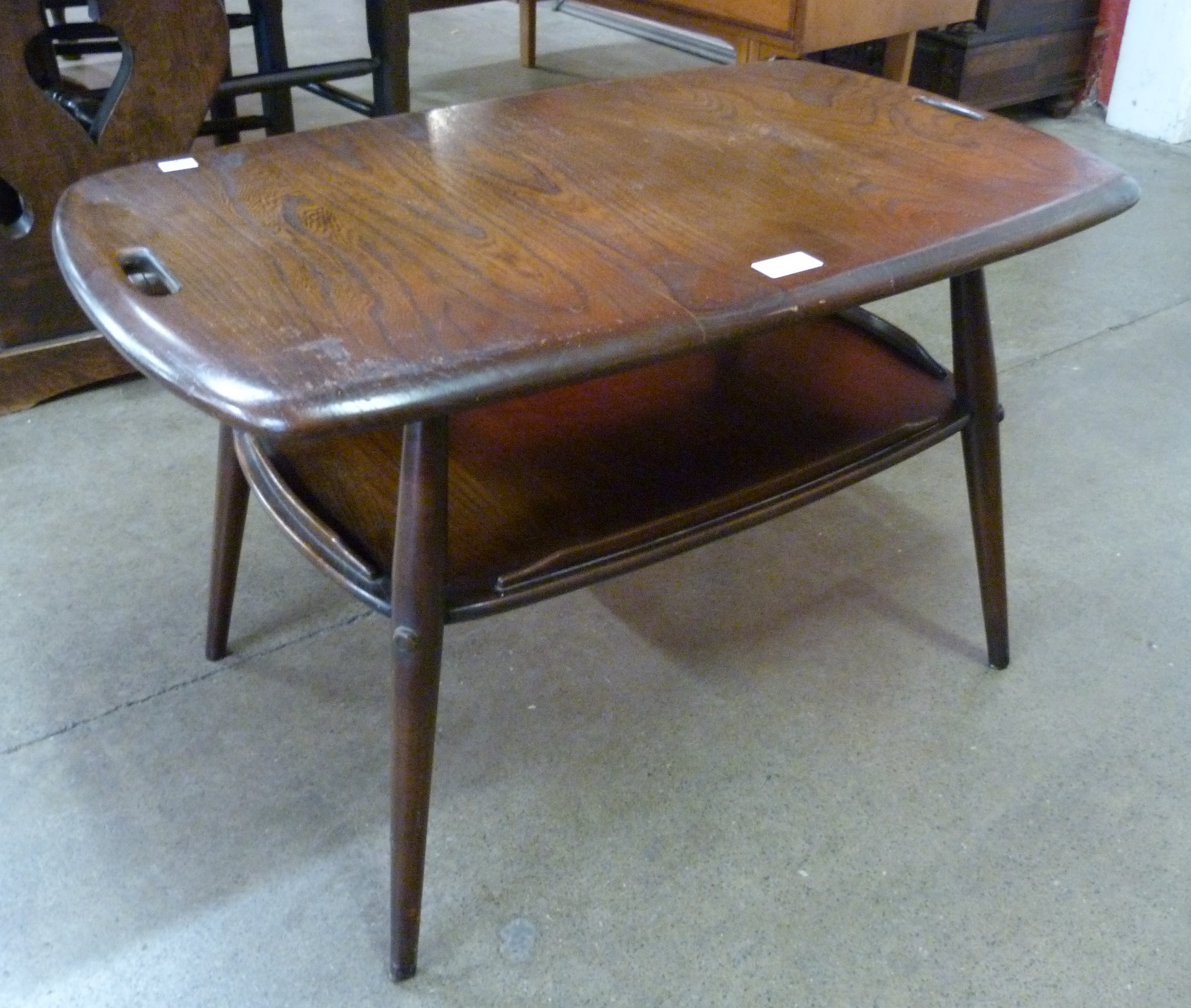 An Ercol Golden Dawn elm and beech tray top Windsor coffee table