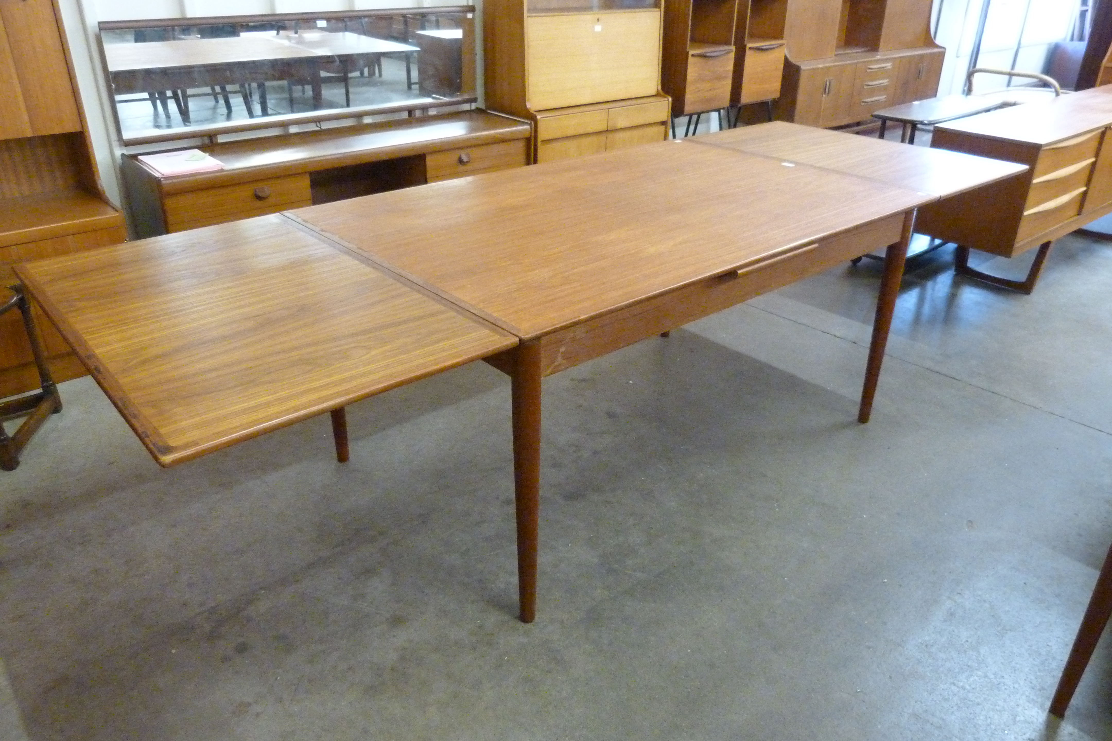 A Danish Koefoeds Hornslet teak extending dining table, designed by Niels Koefoed - Image 2 of 3