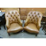 A pair of Regency style tan leather armchairs
