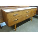 A teak six drawer sideboard