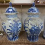 A pair of large Chinese blue and white porcelain vases and covers