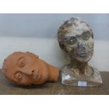 A terracotta lady's head and a faux stone lady's head