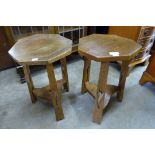 A pair of small Arts and Crafts oak octagonal occasional tables