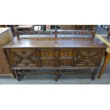 An early 20th Century Jacobean Revival carved oak sideboard