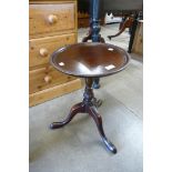 An Edward VII mahogany circular tripod wine table