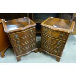 A pair of small mahogany serpentine chests of drawers