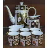 A Royal Crown Derby 2451 pattern coffee set, one cup and saucer second quality