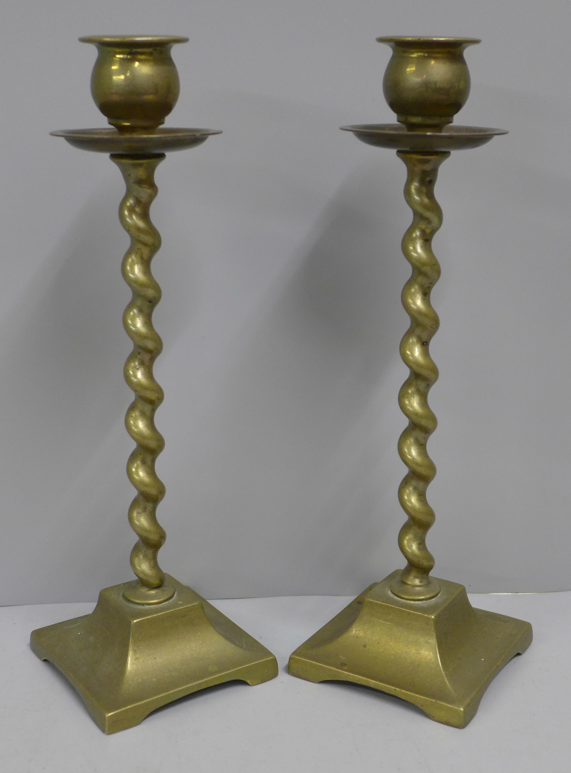 A pair of brass barleytwist candlesticks