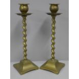 A pair of brass barleytwist candlesticks