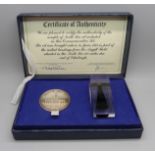 A 1975 commemorative set of North Sea Oil medallion and oil sample first landed