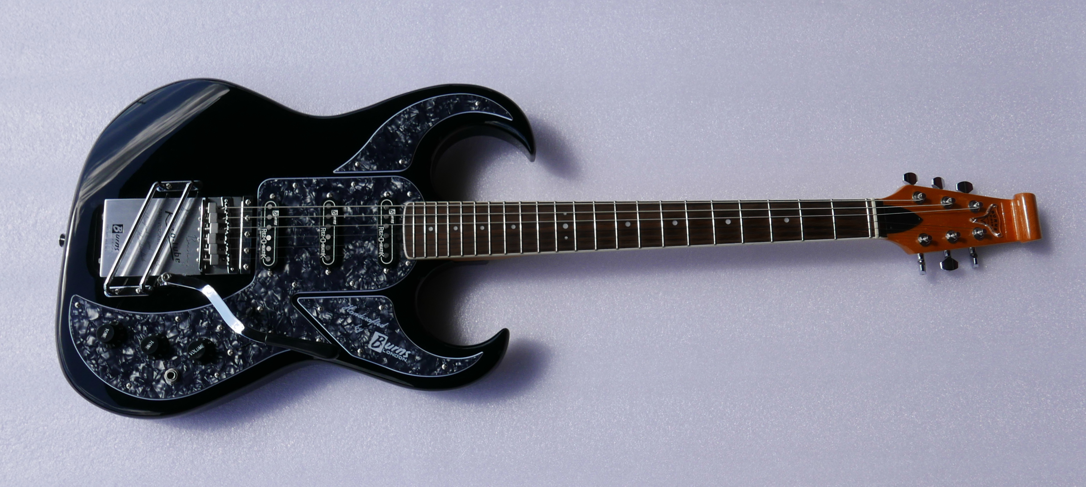 A Burns Bison electric guitar, anniversary model in original snakeskin case and a 50 Years of