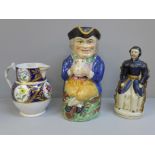 A Victorian cross-legged Toby jug with hat lid, one other jug, repairs to handle and chips to rim