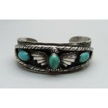 A Egyptian-style turquoise set bangle