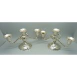 Two sterling silver three light candlesticks, marked 'cement filled'