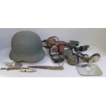 Military items with helmet, monoculars, compass, etc.