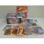 A tin and other loose Yu-Gi-Oh cards