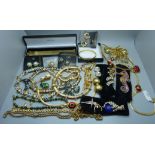 A collection of gold tone jewellery, some boxed
