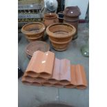 A terracotta wine rack, a strawberry pot, chimney pot and a pair of planters, etc.