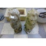 A pair of reconstituted stone garden figures of lions