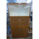 An Eastham simulated rosewood kitchen cabinet