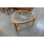 A Nathan teak and glass topped coffee table